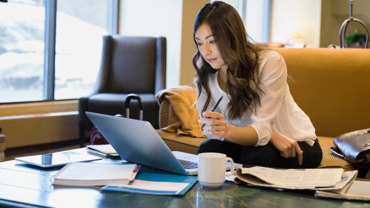 Lady looking-at-her-laptop-1280x720